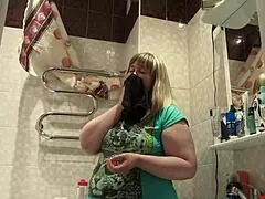 Chubby mature woman explores personal items in amateur setting