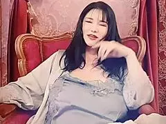 The blue satin fabric is the highlight of this asian solo webcam video from japan