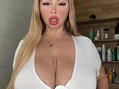 an adult milf with natural tits is waiting, caressing them gently