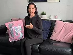 a british housewife tries on lingerie with stockings and corset