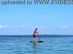 Amateur mature woman enjoys outdoor kayak adventure