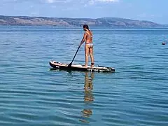 Amateur mature woman enjoys outdoor kayak adventure