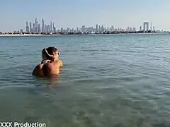 Monika fox swims naked in the sea and walks along the beach freely.