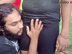 Indian couple sharing sweet kisses and romantic moments in their bedroom.
