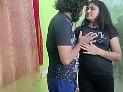 Indian couple sharing sweet kisses and romantic moments in their bedroom.