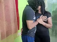 Indian couple sharing sweet kisses and romantic moments in their bedroom.