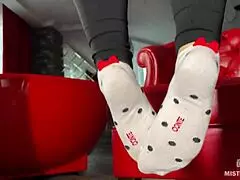 Goddess teases wrinkled feet in socks and barefoot under desk