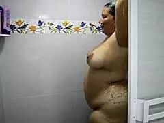 The cute Colombian BBW with huge natural tits gets bent over in the shower, her tight pussy squirting