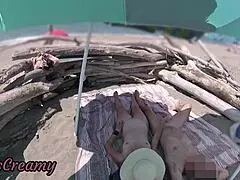 two exhibitionist wives give amateur milf handjob to big cock on nude beach in front of voyeur with cumshot