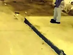 Mature woman in red thong and transparent leggings on street