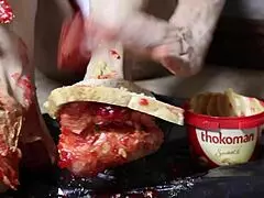 Blonde Bodybuilder Spreads Peanut Butter on Feet for Steamy Footjob Fantasy