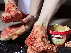 Blonde Bodybuilder Spreads Peanut Butter on Feet for Steamy Footjob Fantasy