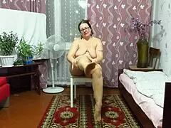 check out this chubby milf's big tits while she teases feet in pantyhose