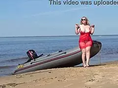 Milf spreads juicy ass and pussy wide on sunny beach