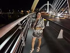 wow, check out this luscious milf flashing her big natural tits on the bridge without bra or panties