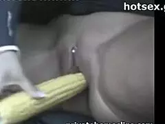 mature woman shoves corn dildo deep in shaved wet pussy car public