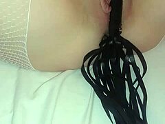 Hairless pussy whipped in BDSM video