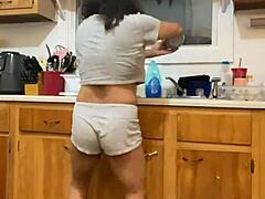 Mature Latina woman does dishes