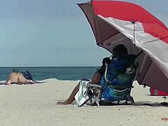 Voyeur captures naked beach antics