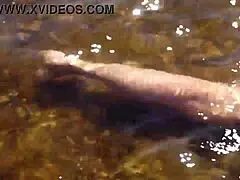 mature woman in bikini at volga river