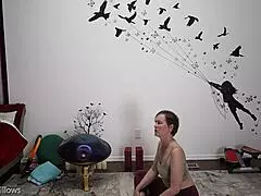 In a private yoga session, the instructor guides through explicit moves, focusing on tight cameltoe and bare feet.